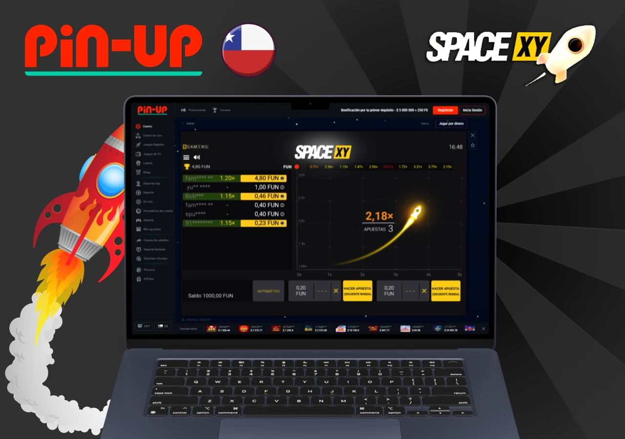Pantalla de computadora con el juego Space XY en Pin-Up Chile mostrando cohete espacial ascendiendo y apuestas en curso